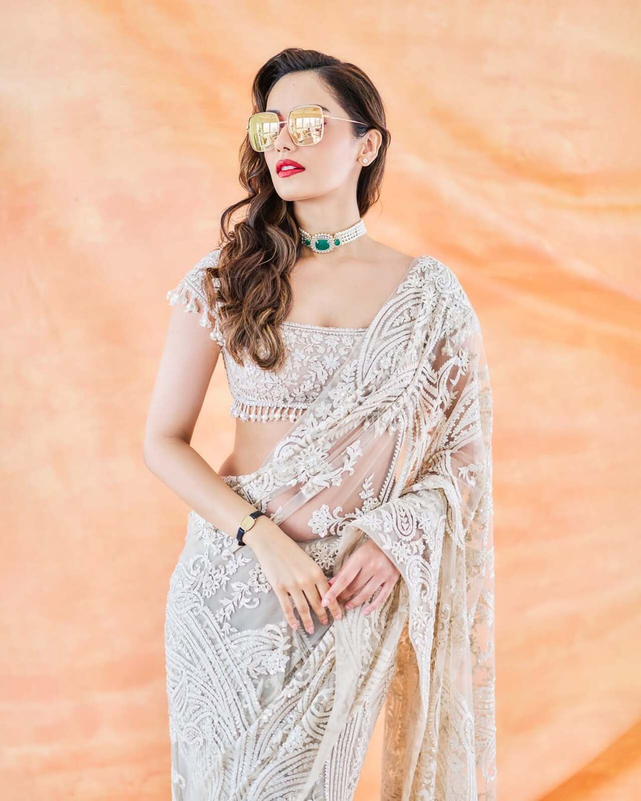 For the trailer launch of Maalik, Manushi stepped out in a heavily embroidered white saree and she looked like a vision to behold when she appeared on stage. 